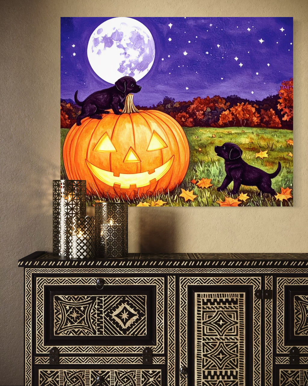 Puppies play on a Pumpkin