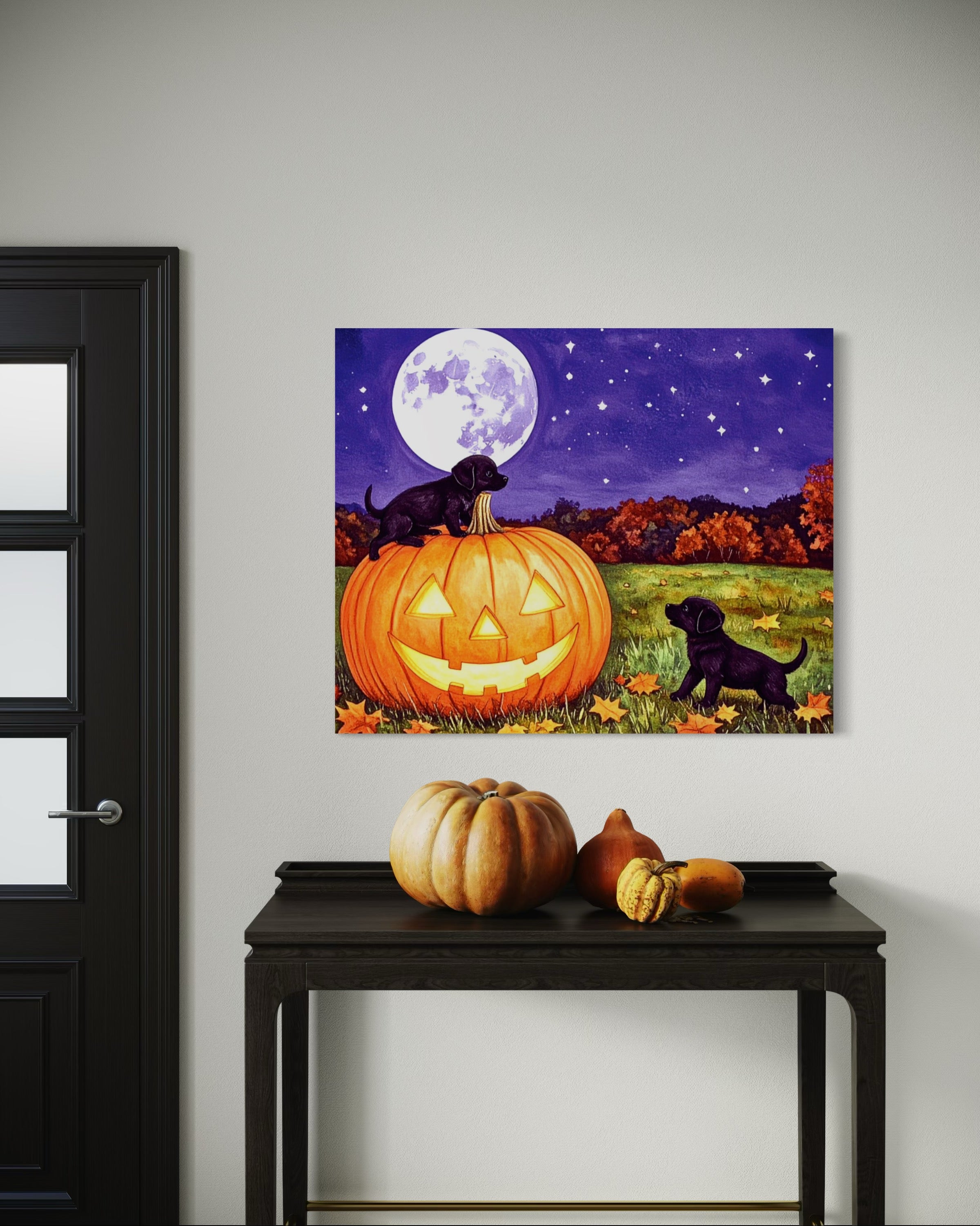 Puppies play on a Pumpkin