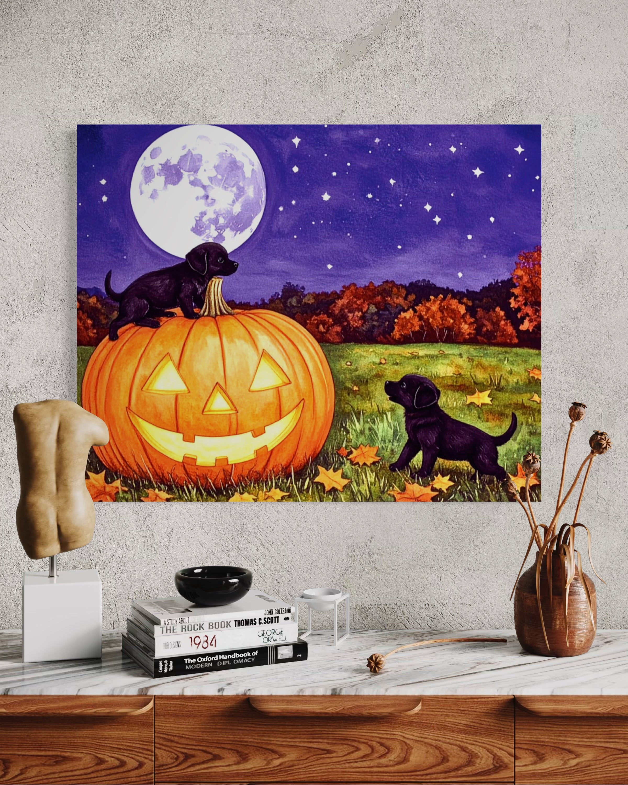 Puppies play on a Pumpkin